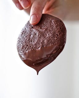 Chocolate dripping off a cookie